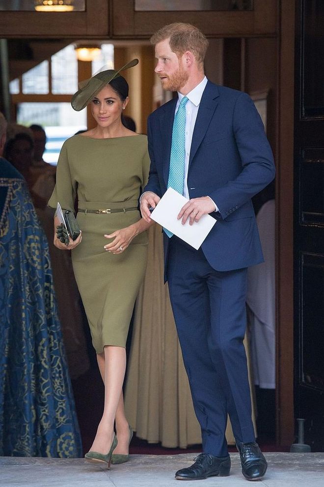 Meghan attended Prince Louis' christening in a stunning olive  green bespoke dress by Ralph Lauren, belted at the waist alongside matching leather gloves and a bespoke olive hat by Stephen Jones. 