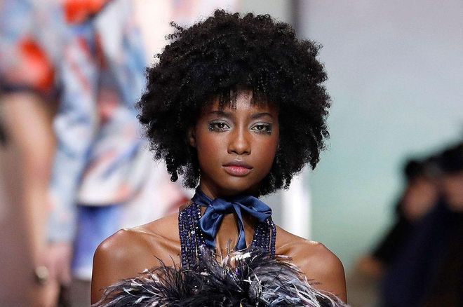 The pastel, watercolor-like eyeshadow and soft pink blush at Armani looked incredible with model Crystal Noreiga's voluminous natural curls.