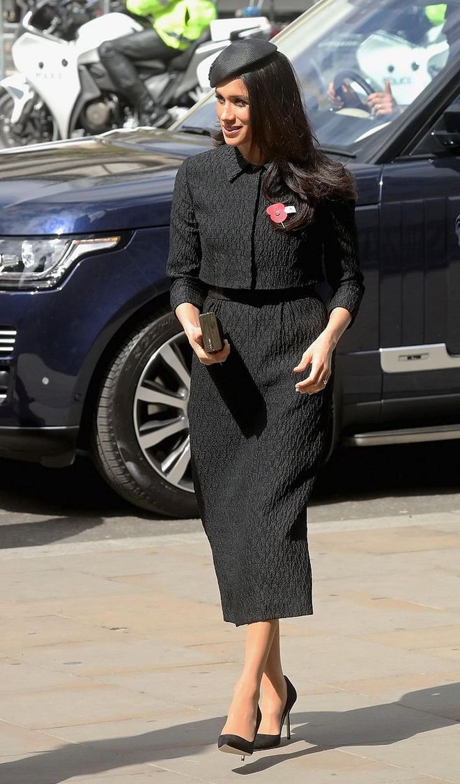 For the dawn service on Anzac Day, Meghan wore a bespoke black two-piece set by New Zealand born fashion designer, Emilia Wickstead as well as a bespoke dragonfly beret by Philip Treacy. She finished off the look with a Jimmy Choo 'J Box' clutch and black Manolo pumps. 