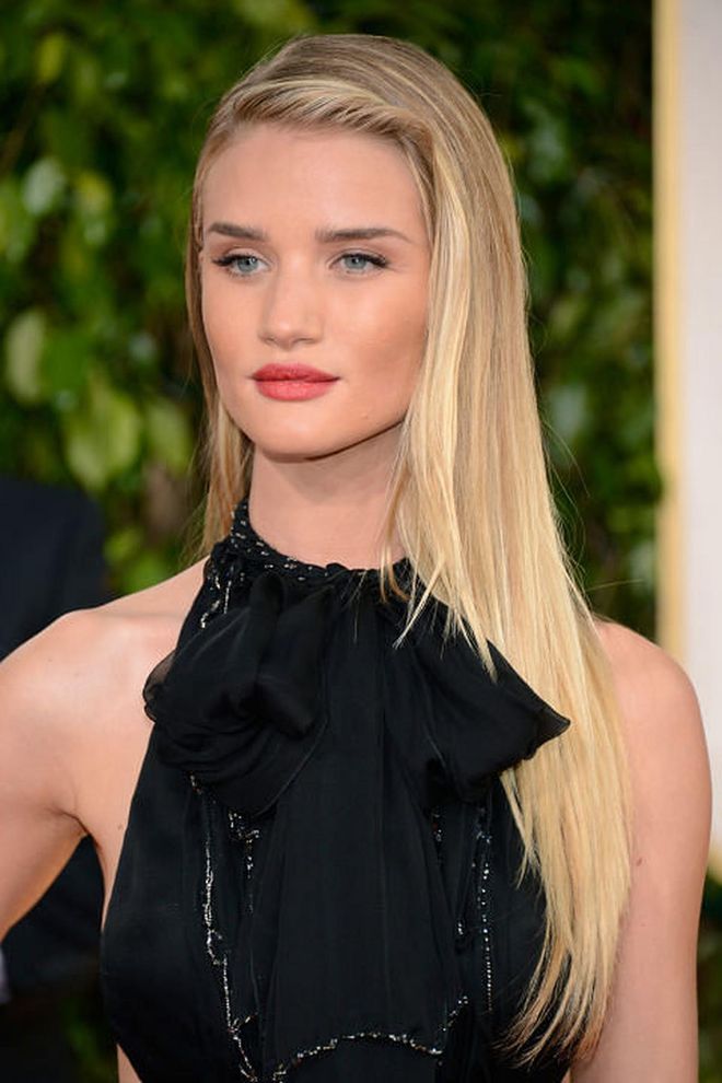 The style: Rosie Huntington-Whiteley lengthened her locks with lighter blonde hair extensions and added a twist detail. Photo: Getty 