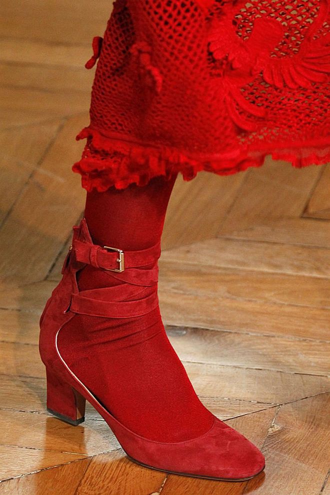Seen in: Paris Fashion Week SS17 // Reason to love: These scarlet suede booties have ankle tour straps that gives this comfort footwear a mouth-watering edge (Photo: Getty)