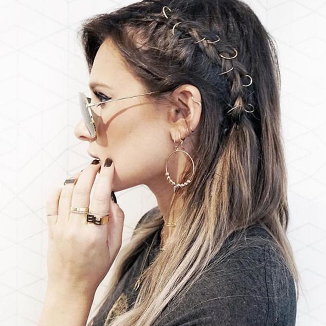 As far as hair accessories go, it just doesn't get cooler than heavy metal rings that you clip into braids. For proof: Look no further than this look that Mane Addicts hairstylist Justine Marjan created for WeWoreWhat blogger Danielle Bernstein. Whether it's two or three, or fifty, you're going to look badass.