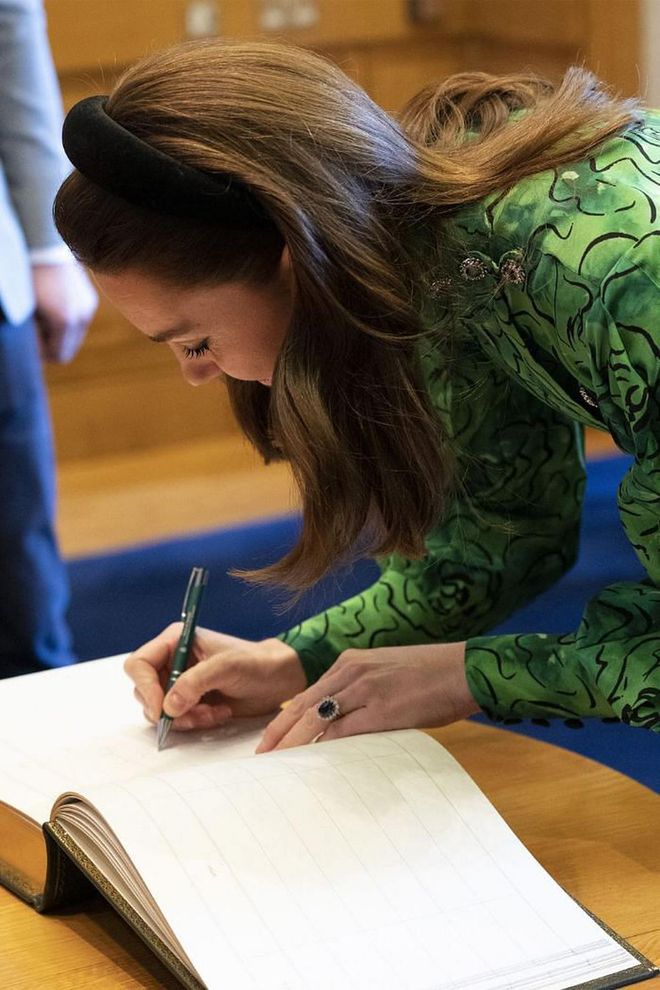 Kate signs the visitors' book after a meeting with Taoiseach of Ireland Leo Varadkar and partner Matthew Barrett during a visit to the Government Buildings.

Photo: Getty
