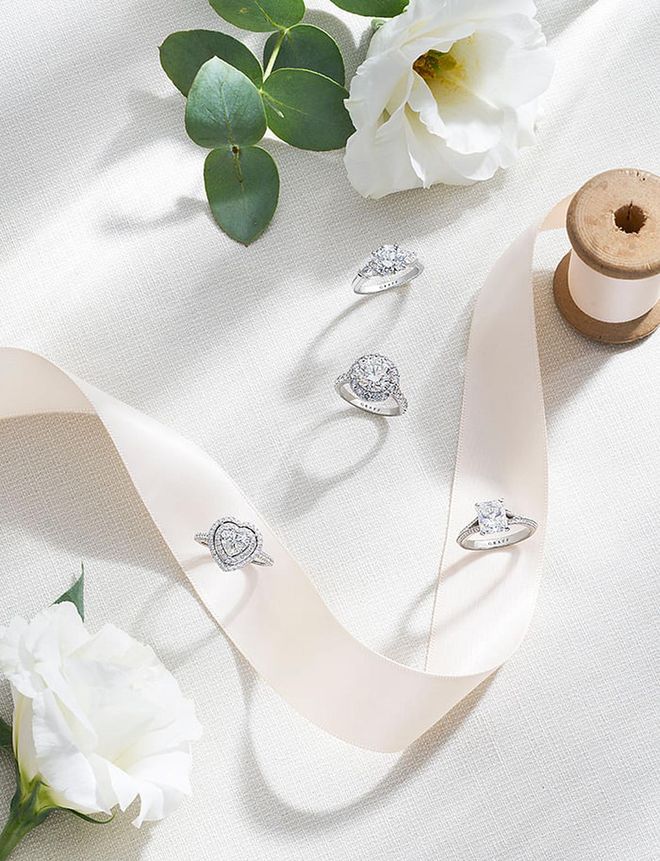 Clockwise from top: GRAFF Promise ring with a 2.01- carat round diamond; Icon ring with a 3.02-carat round diamond; Legacy ring with a 2.01-carat radiant‑cut diamond; Constellation ring with a 1.06-carat heart‑shaped diamond.