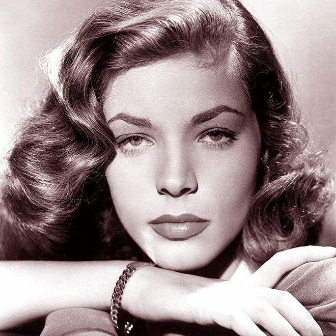 Best known for being a sultry silver screen siren with a sensuous voice, the ravishing Bacall was also the last living legend mentioned in Madonna’s hit song “Vogue”. This lady with an attitude also set the beauty standards of her time with her crimson lips and shiny, side swept S-curve hair that cascaded down her décolletage like a flaxen waterfall—a look still heavily referenced in modern fashion of today.