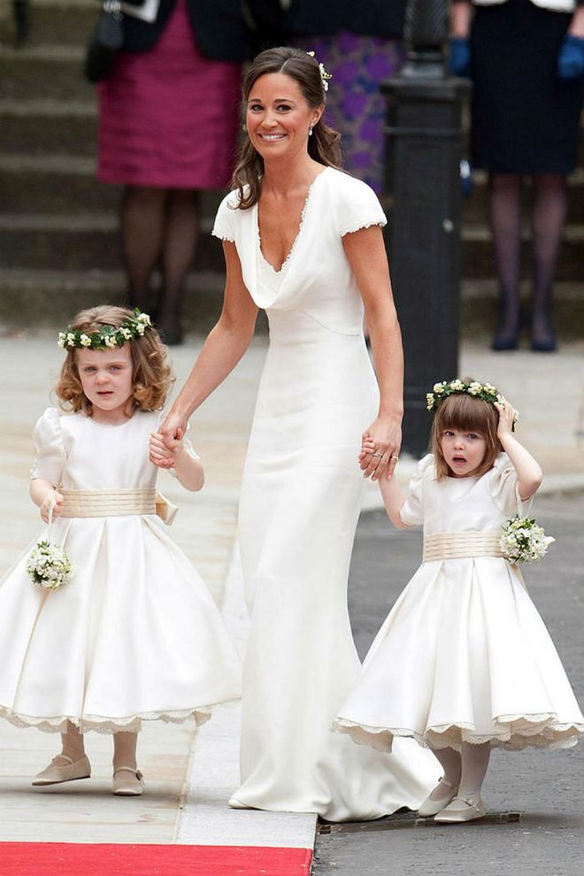 Sister of the bride and Maid of Honor Pippa Middleton, wearing Alexander McQueen, escorts bridesmaids Grace Van Cutsem and Eliza Lopes.
Photo: Getty
