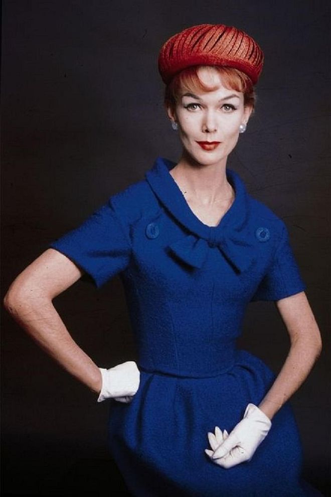 A model wearing blue dress, red hat and white gloves.

Photo: Getty