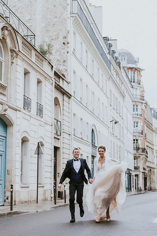 Even though the day of their actual ceremony turned out rainy and cold, this Russian and French duo, who met in China, remain all smiles while running through the streets of the 7th arrondissement of Paris.

Via The Flying Poodle Photography

