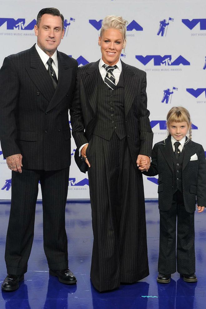 Achieving the impossible and actually making matching family outfits look cool, Pink, her husband Carey Hart and their daughter Willow all wore identical black pin-striped suits to the MTV VMAs. Photo: Getty