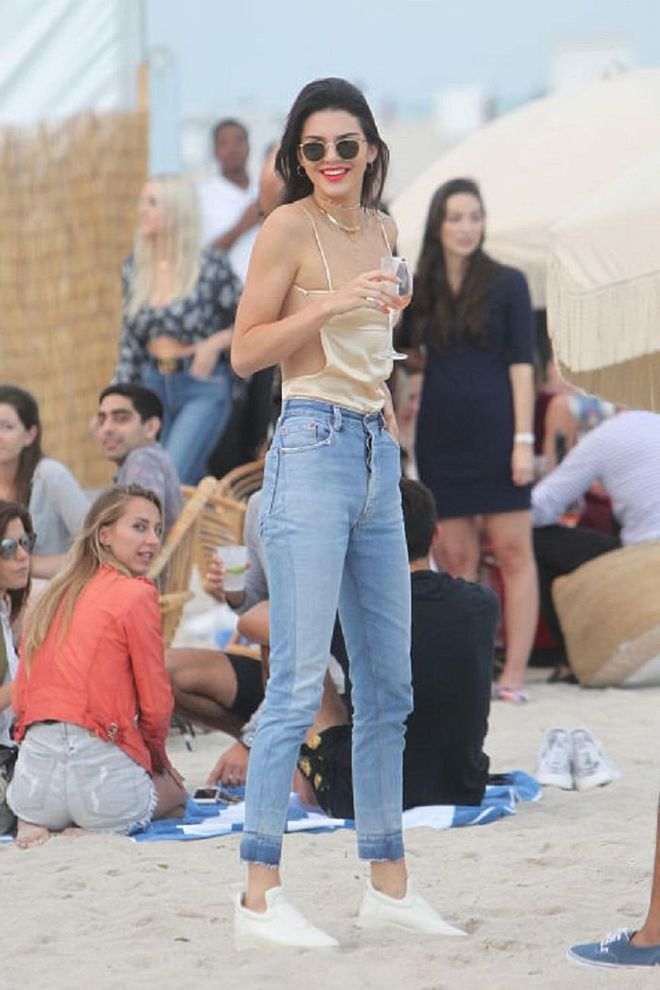 Sneakers may not be the most practical option for the beach, but if you're not actually planning to test the waters, pull a Kendall Jenner and pair them with a barely-there spaghetti strap top (for the tanning benefits) and a high-waisted pair of jeans. <b>Silk Misa Top, S$250</b>