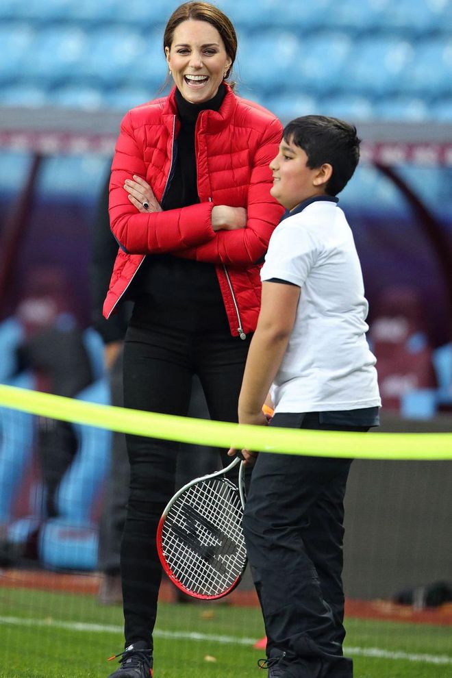 The Duchess watches a tennis lesson while visiting the Aston Villa Football Club to see the work of the Coach Core program.
Photo: Getty