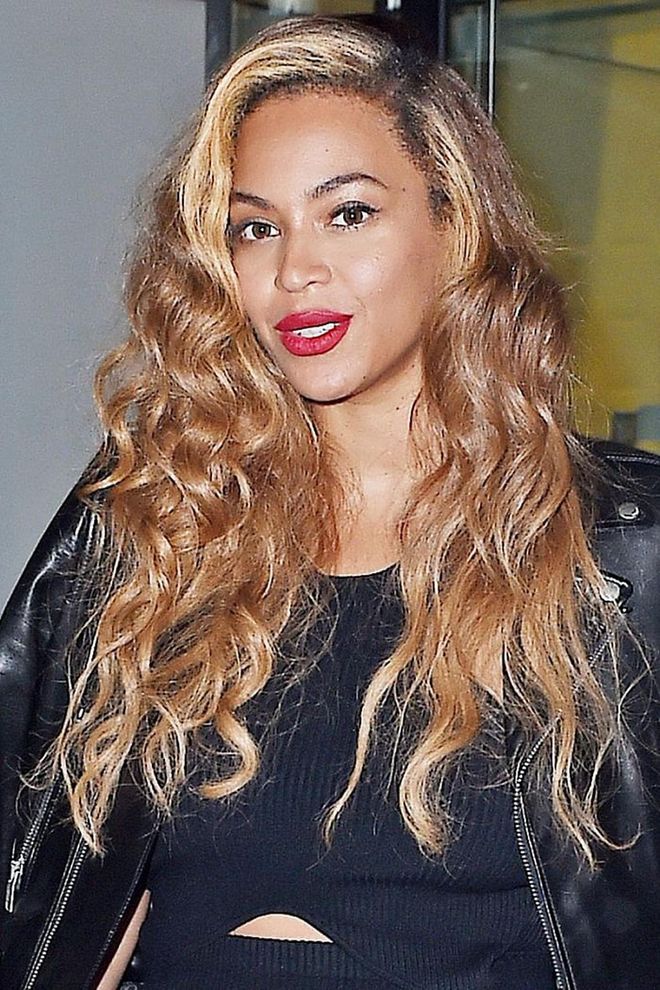 Beyonce opts for a bleach blonde streak to frame her face and balances it out with honey blonde strands. Photo: Getty