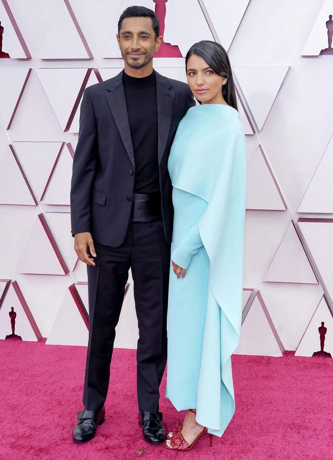Riz Ahmed, left, and Fatima Farheen Mirza arrive at the Oscars on Sunday, April 25, 2021, at Union Station in Los Angeles. (AP Photo/Chris Pizzello, Pool)