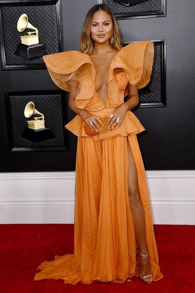 On hand to support husband John Legend, Chrissy Teigen brought some much-needed colour to the Grammys red carpet in the hue of the season, tangerine. Her ruffled dress was by Yanina Couture and she accessorised with a matching clutch bag and plenty of sparkly jewels. Photo: Getty