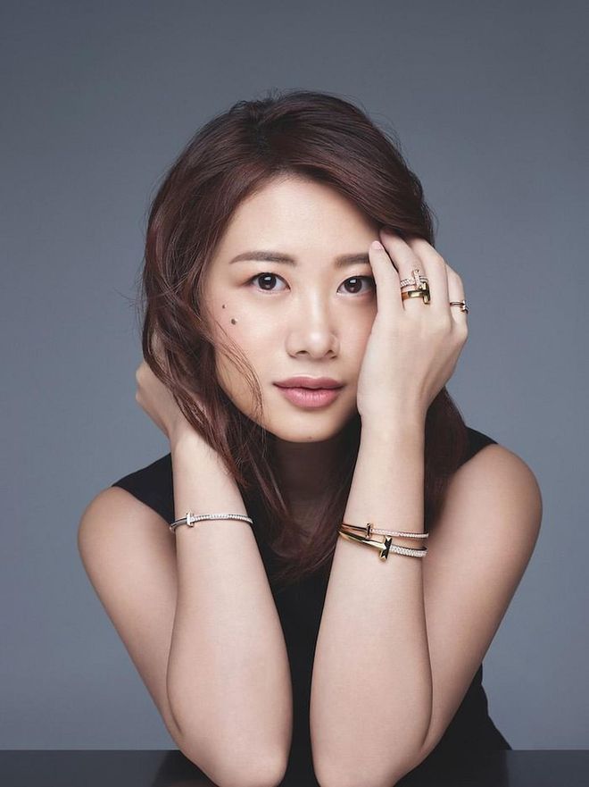 Pocket Sun wears Rose gold and  diamond wide ring; gold wide ring; rose gold and diamond narrow ring; rose gold and diamond narrow hinged bangle; gold and diamond wide hinged bangle; white gold and diamond narrow hinged bangle. Dress, Hermès. (Photo: Wee Khim)
