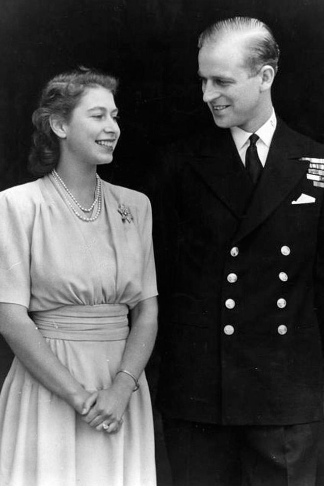 Princess Elizabeth and Philip Mountbatten, Duke of Edinburgh, celebrating their engagement at Buckingham Palace in 1947.