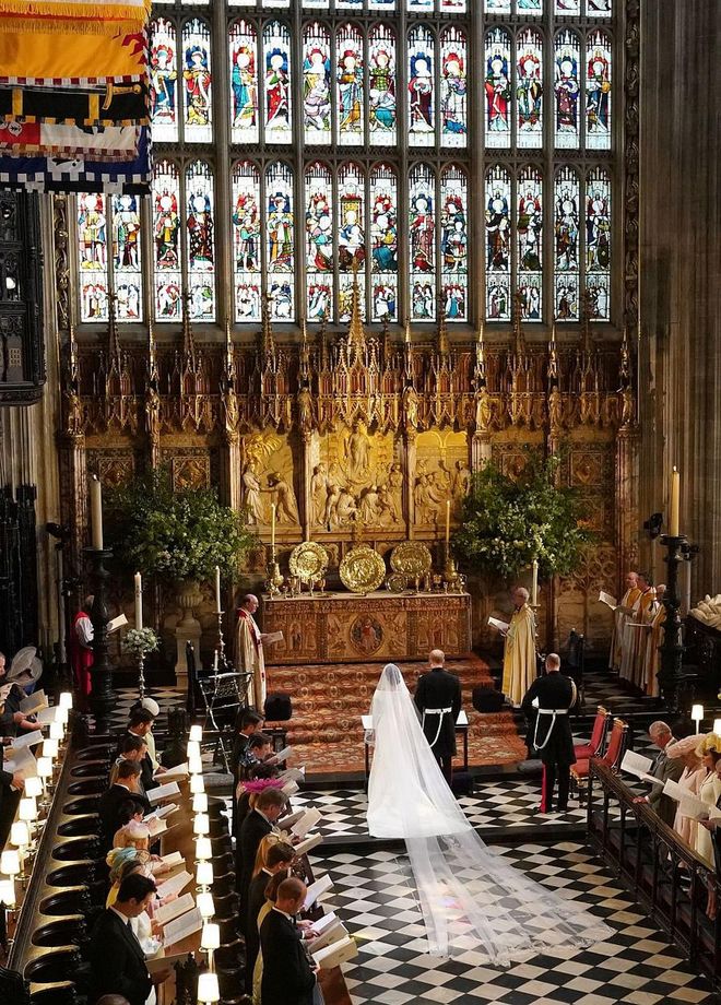 Prince Harry and Meghan Markle stand at the altar