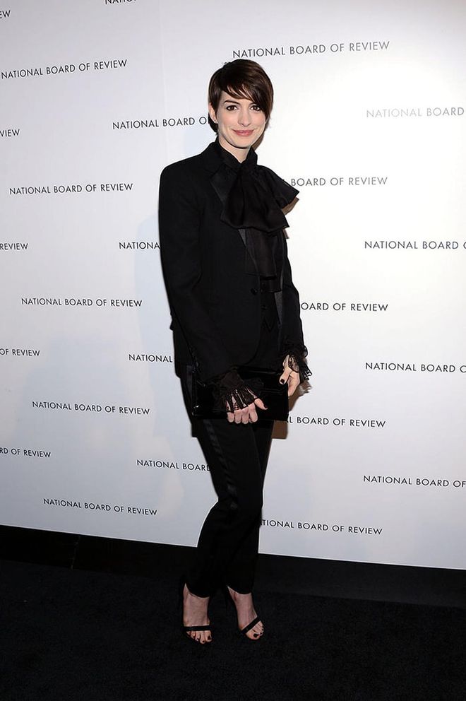 Anne Hathaway in an all-black button-down getup although we're sure its's the pixie hair that made the cut. Photo: Getty