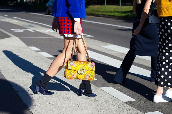 Fashion Blogger Marissa Karagiorgos wearing a Marc Jacobs jacket, Miu Miu skirt, Camilla and Marc boots and Gucci bag. Photo: Getty 
