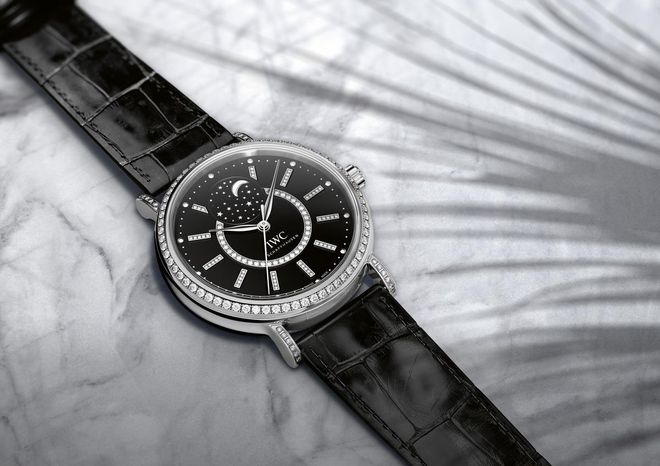 HANDOUT - The Portofino Midsize Automatic Moon Phase (Ref. IW459004) from IWC Schaffhausen. Case in 18-carat white gold set with 90 diamonds, black lacquer dial set with 84 diamonds, black alligator leather strap with pin buckle in white gold. (PHOTOPRESS/IWC)
