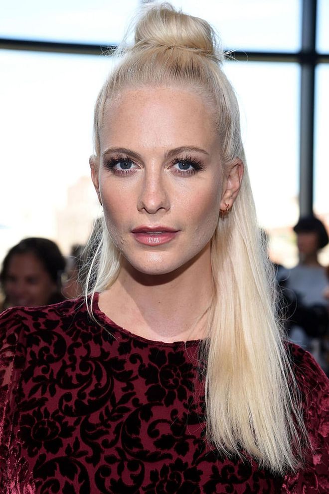 Poppy Delevingne's ultra slicked-back hair is well-suited for a night on the town. Photo: Getty