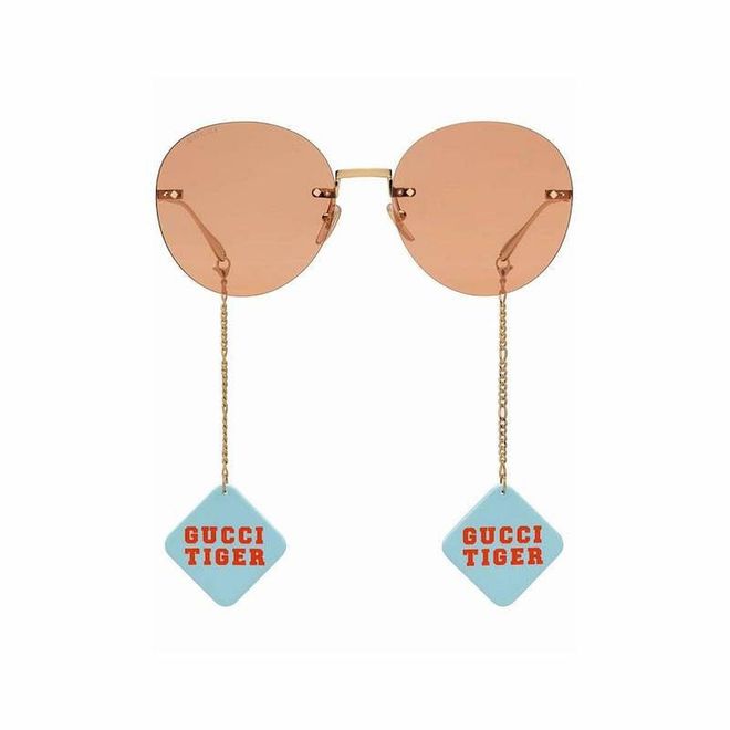 Round-Frame Logo-Charm Sunglasses, $587, Gucci at Farfetch