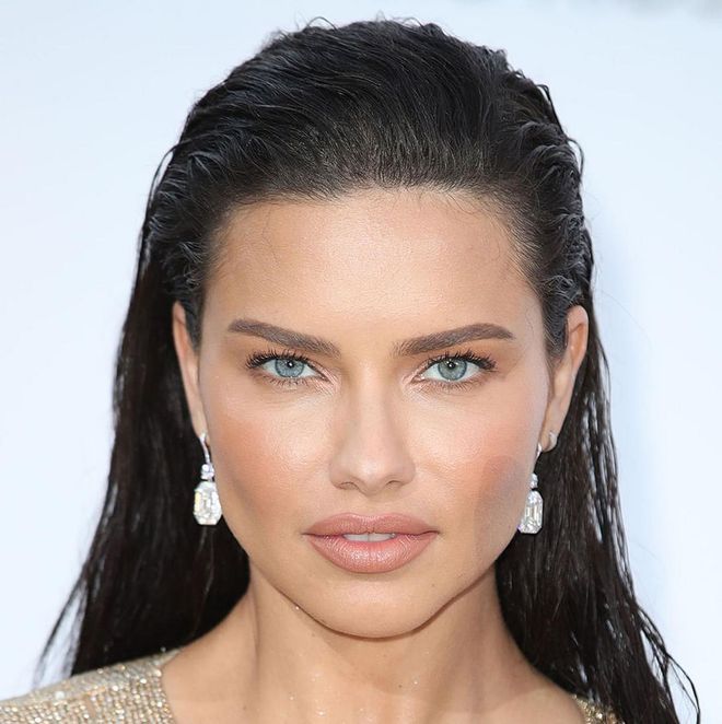 Adriana Lima proves that matte skin doesn't have to mean flat skin. We love how her skin still glows in all the right places, but overall her skin is powdery, nude, and flawless.
Photo: Getty