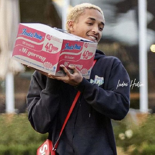 Jayden Smith carrying a box of Indo Mee. This is all part of The Smith's nutritious diet. 