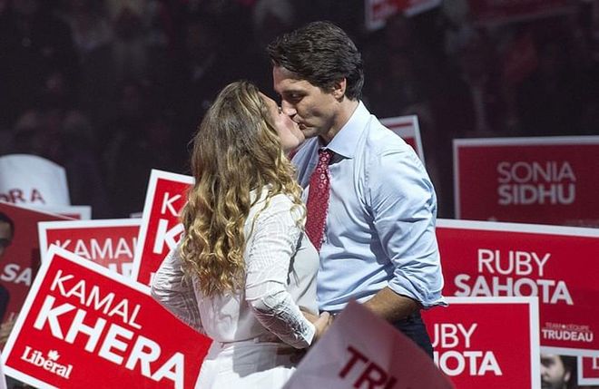 Kissing each other before he takes the stage during a rally in Ontario, Canada. Photo: Getty 
