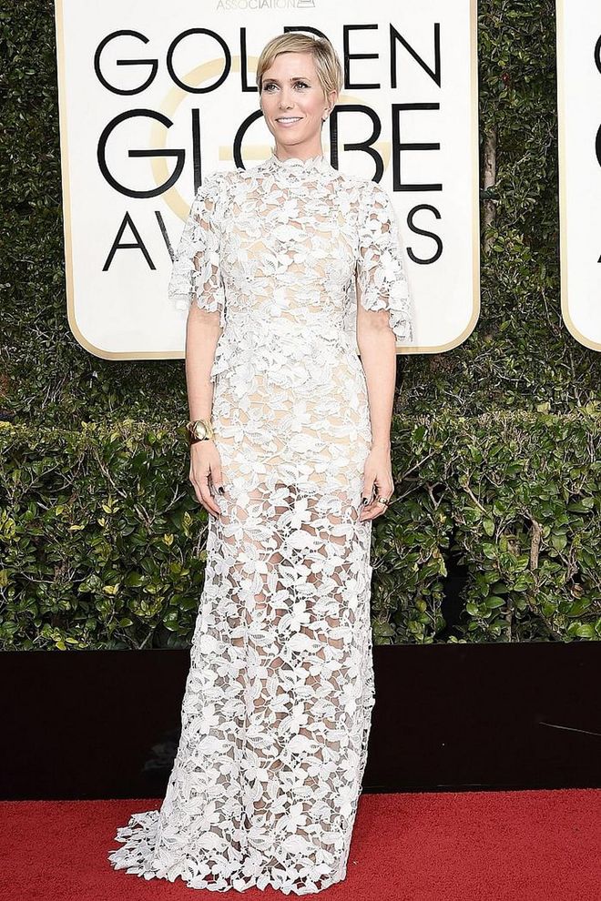 Kristin Wiig looked romantic yet modern in a mock neck, flutter sleeved look with a semi-sheer skirt that showed off her heels. The look suited the quirky starlet just as much as it would a more contemporary version of a beach bride. 
