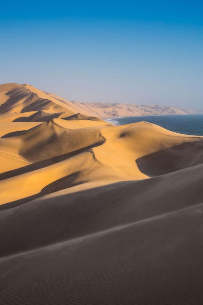 The massive sand dunes alone are reason to book a trip to Walvis Bay. But you'll also want to come to this beach on Namibia's Skeleton Coast for the wildlife—you're likely to spot flamingos, seals, whales and even hyenas here.