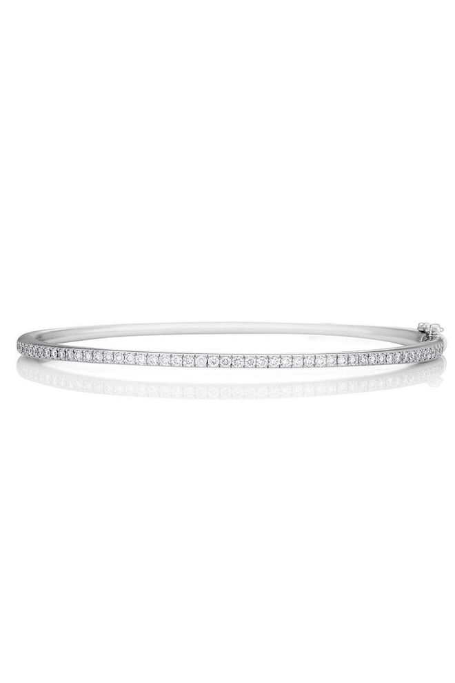 This slim De Beers bracelet is the perfect accessory for day and night with intricate pavé-diamond detailing.