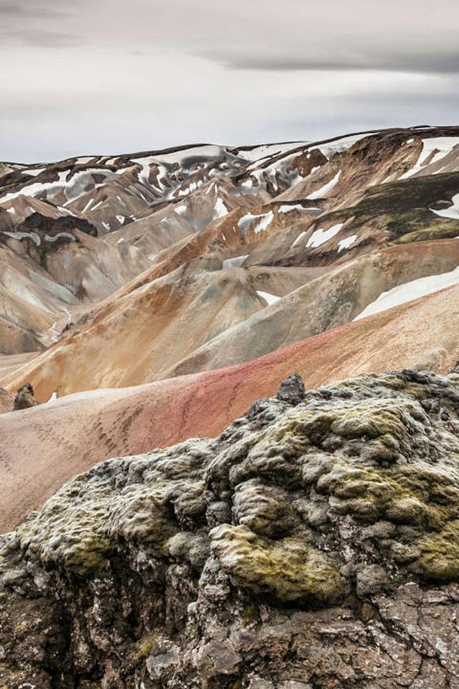 Iceland's interior is largely uninhabited and difficult to get to. But if you can access the right kind of car to get through the rough terrain, the otherwordly landscapes you'll see at Landmannalaugar—including multicolored rhyolite mountains—will be a highlight of your trip. Photo: Getty