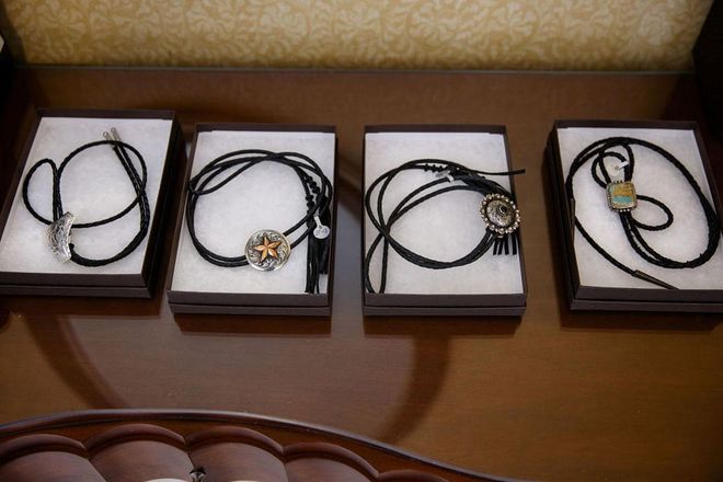 In keeping with the theme of the night, bolo ties were doled out to participants in the ceremony, but (no surprise here) the couple opted out of having traditional bridesmaids and groomsmen. Photo: Lara Porzak