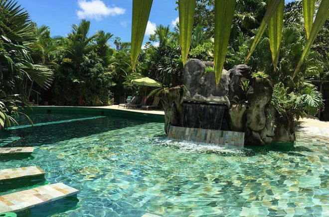 Sit back and enjoy the naturally warm waters of these waterpools surrounded by La Fortuna's beautiful tropical gardens. Photo: Tripadvisor