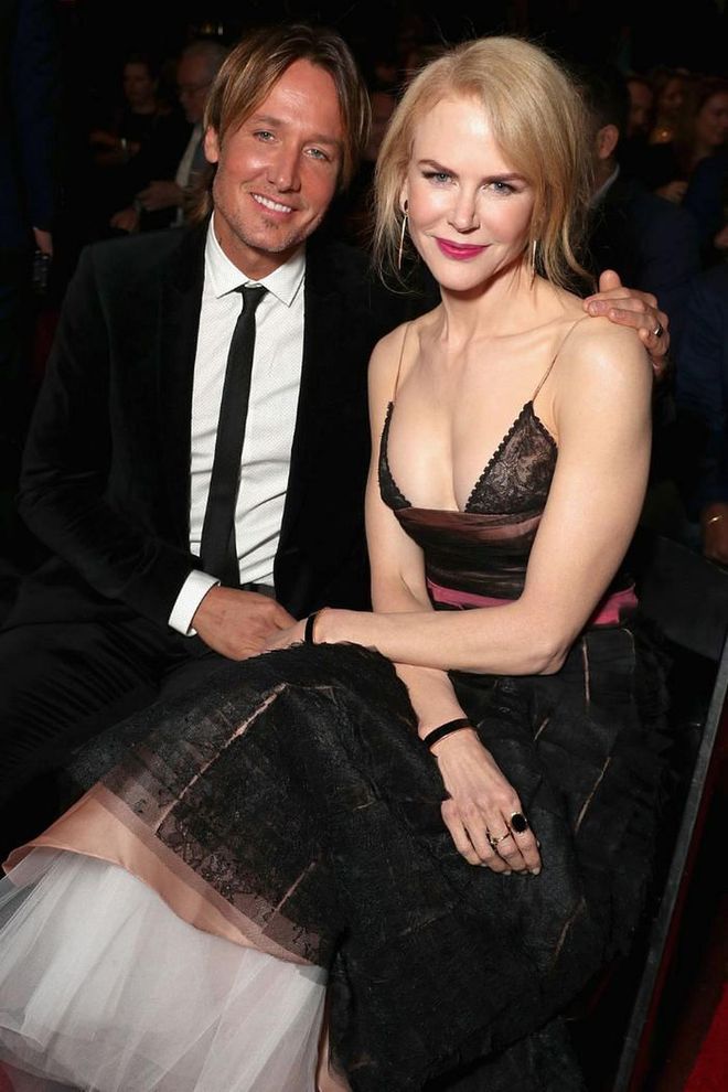 After a public divorce with Tom Cruise in 2001, Kidman felt she might never find love again. "It took me a very long time to heal," she admitted to DuJour in 2012. "It was a shock to the system." However, in 2005, Kidman caught Keith Urban's eye at the G'Day USA gala. After some back and forth courting, the two Aussies became engaged and walked their first red carpet together at the 2006 Grammys.

"I have a wife who is just from another planet," Urban told Rolling Stone in 2014. "She is so celestial. I say that I was born into her. That is the best way I can describe how I feel about her and us."

13 years later, the couple share two daughters together: Sunday Rose and Faith Margaret. Kidman also has two adopted children with Tom Cruise: Isabella and Connor.

Photo: Getty
