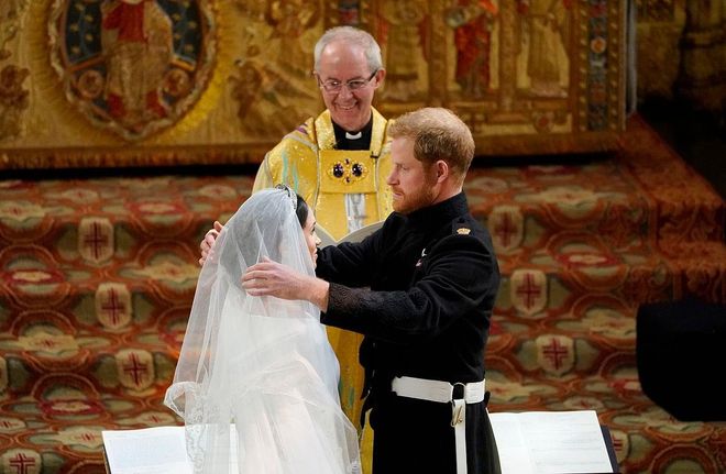 Prince Harry lifting Meghan Markle's veil