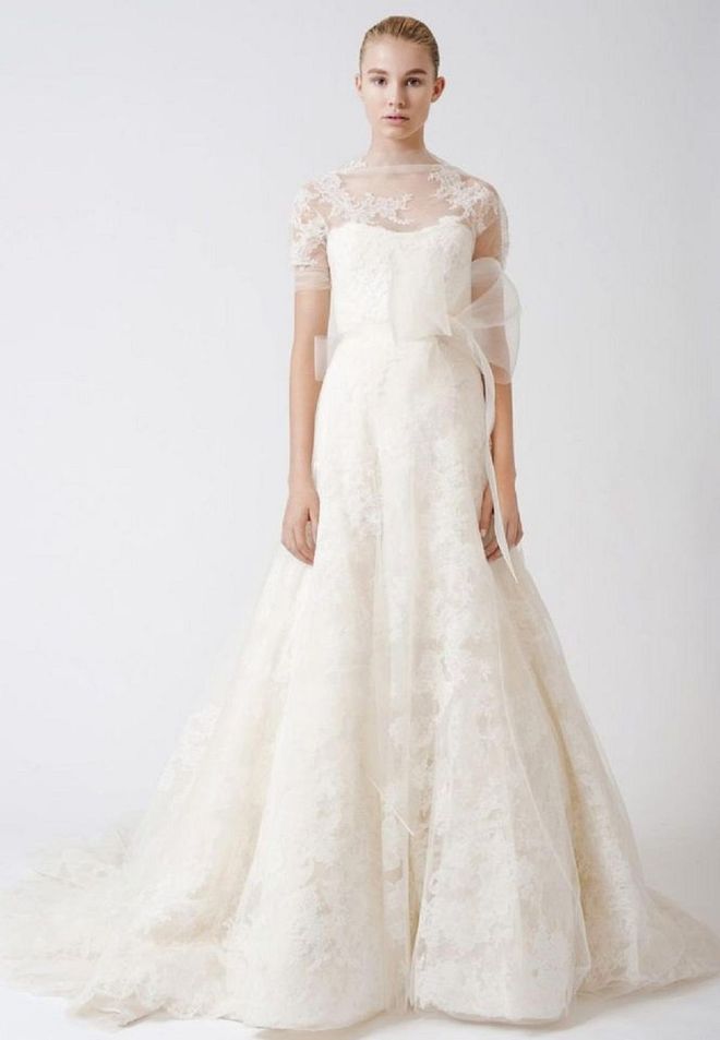 One of Vera Wang's best-selling looks bears similarities to Pippa's wedding gown as well. Esther, which Ivanka Trump actually wore down the aisle in a customized version for her wedding to Jared Kushner, now feels like a bridal staple due to its timeless, classic feel. It's removable topper seamlessly incorporates into the gown's style, and its more sheer qualities and Chantilly details give the gown a lighter feel than Pippa's cotton, crochet bespoke lace. Consider this option if you like the look of Pippa's, but are looking for something with a little less heft.

Vera Wang Bride "Esther," gown, price upon request, verawang.com