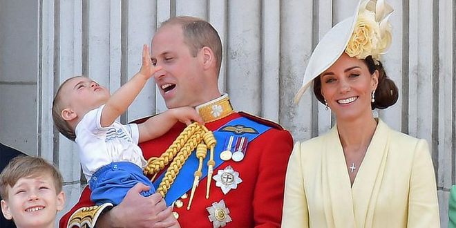 William takes Louis in his arms and entertains the young prince at his first Trooping the Colour.

Photo: Getty