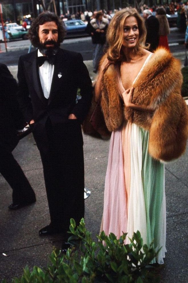 Lauren Hutton was an example of the relaxed glamour of the '70s in her rainbow Halston gown and chubby fur jacket.