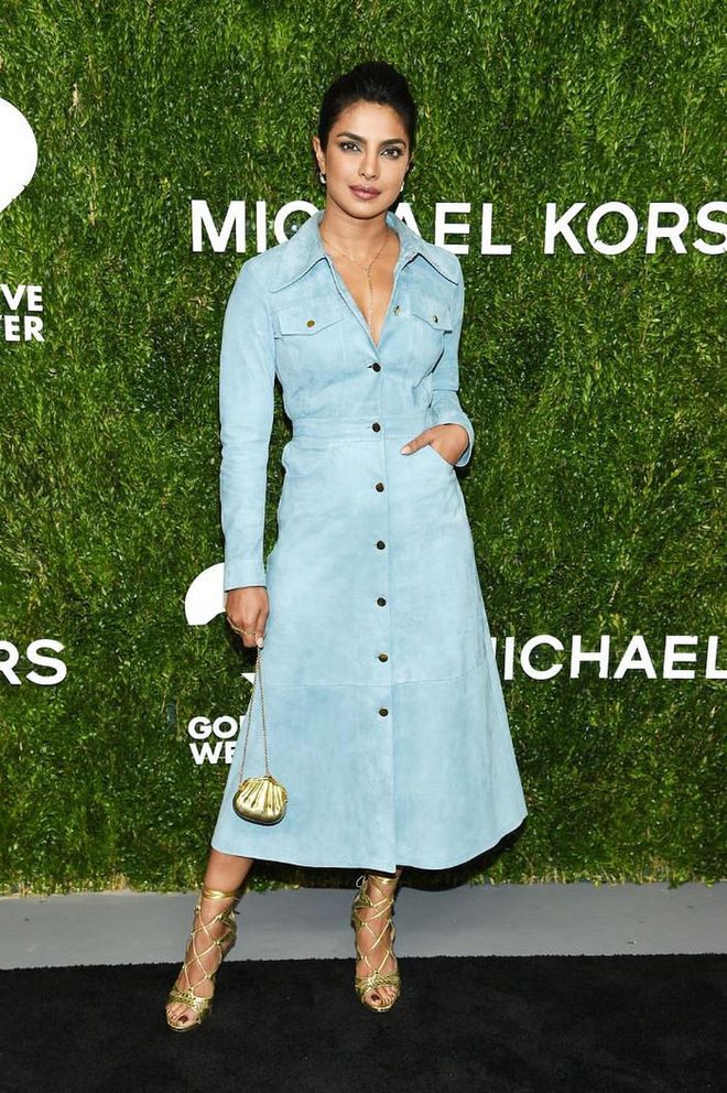 In a blue Michael Kors shirtdress and gold accessories at the brand's God's Love We Deliver event.

Photo: Getty