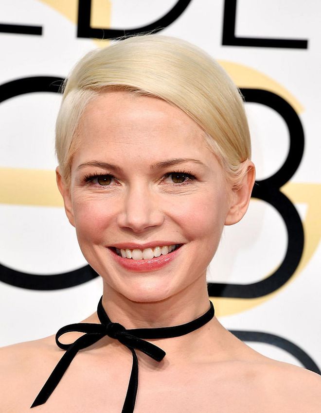 With just a wash of blush and a swipe of gloss, Michelle Williams lets her super shiny platinum blonde hair take centrestage. 

Photo: Getty Images