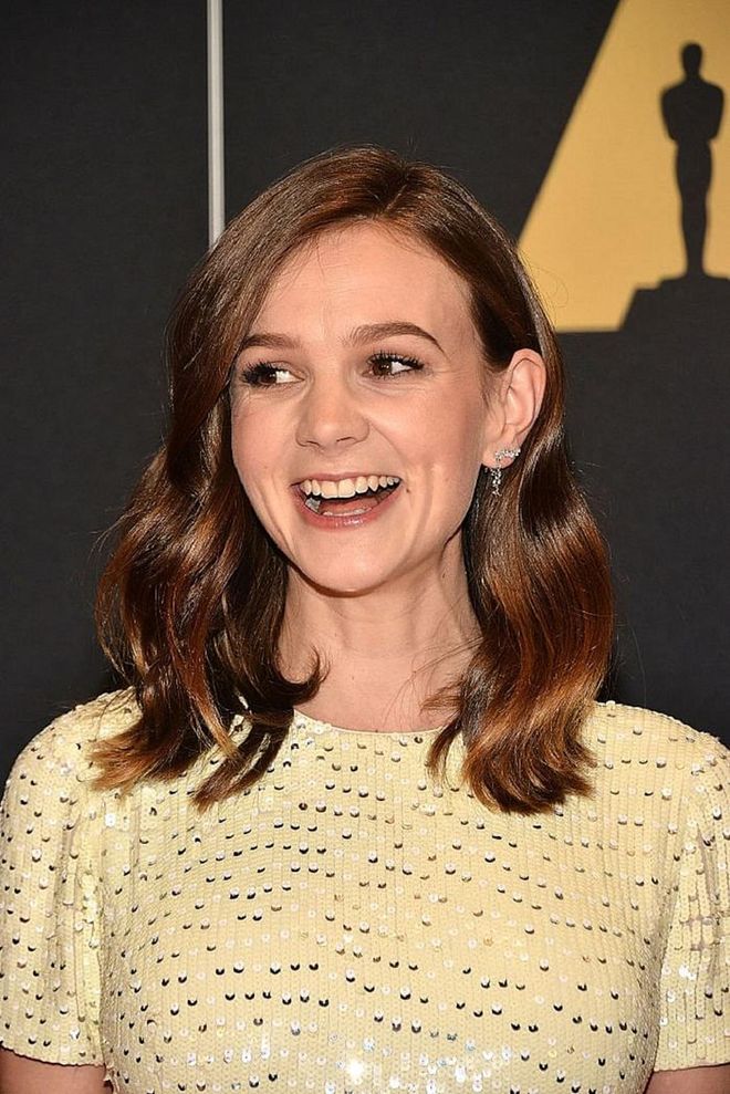 To recreate the soft texture of Carey Mulligan's tresses, wrap your hair in large velcro rollers before directing your blow-dryer through your hair sections. This ensures soft voluminous waves with minimum effort. 

Photo: Getty Images
