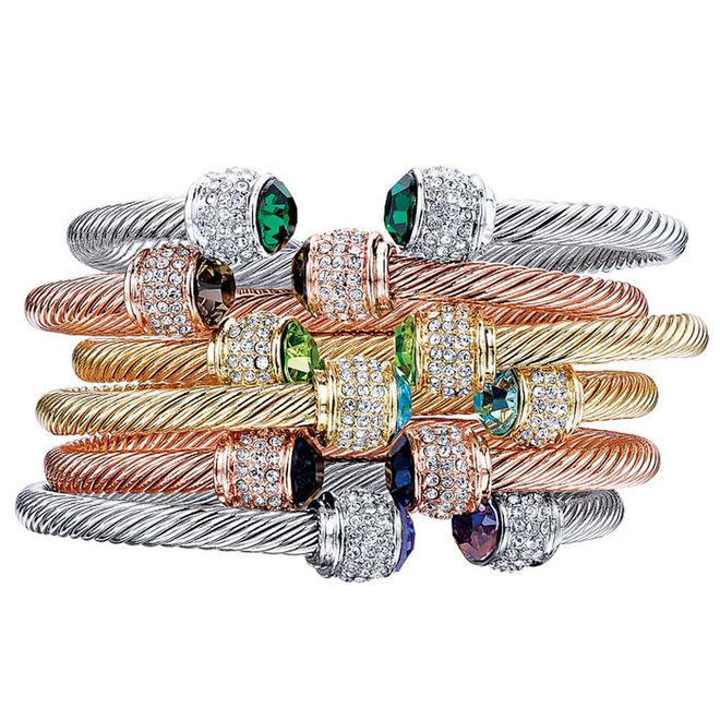 There is a Fervor Montréal Bella bangle for every  personality. Choose from a selection of gold or rhodium plated adjustable bands that are finished with three rows of clear crystals around each cap. Crowned by colourful Swarovski crystals at either end, stack these dazzlers for maximum effect.
