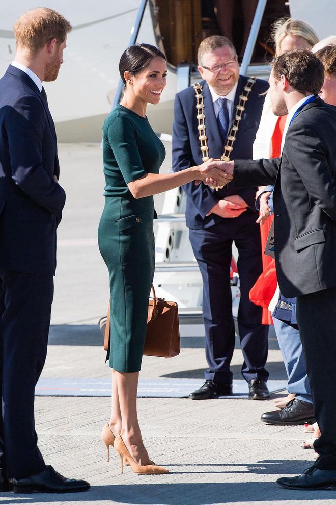 The couple greets their welcomers on the tarmac.

Photo: Getty