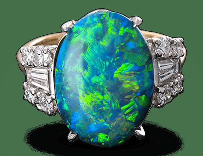 18kt gold and platinum ring with black opal and diamonds, $36,000, rauantiques.com.
