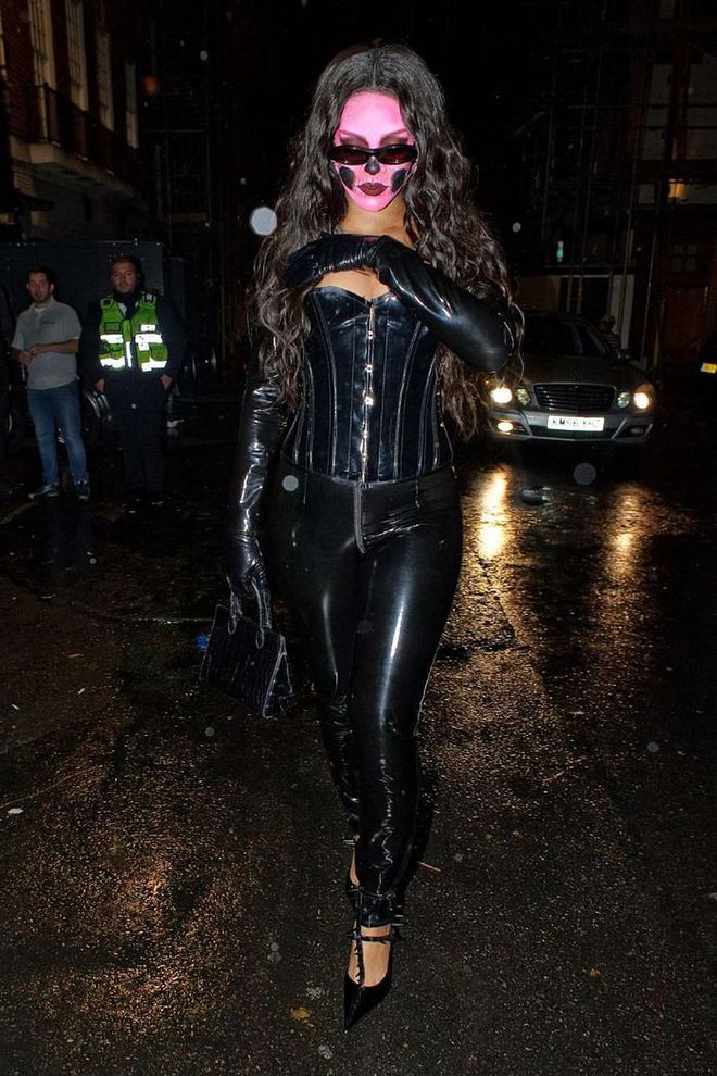 At Halloween last year, Rihanna wore a full-black latex ensemble with spooky bubblegum pink make-up look and a pair of sunglasses.

Photo: Getty Images