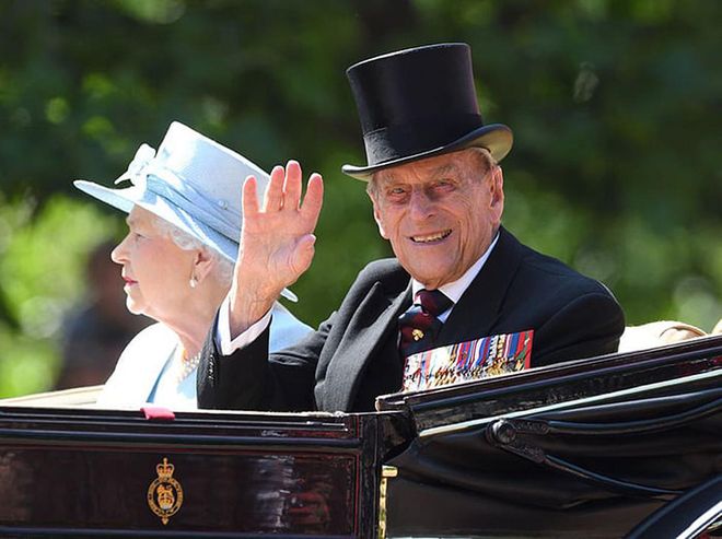 Queen Elizabeth II and Prince Philip during the Trooping the Colour parade the following year.