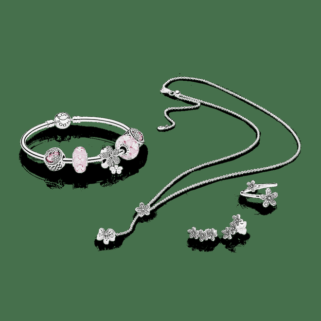 (From left) PANDORA Moments silver bangle, $129; Dazzling Daisy Meadow charm, $149; Pink Bloom Murano Glass, $89; Dazzling Daisy Duo pendant charm, $149; Dazzling Daisies necklace, $149; Dazzling Daisy Clusters stud earrings, $99; Dazzling Daisies ring, $99
