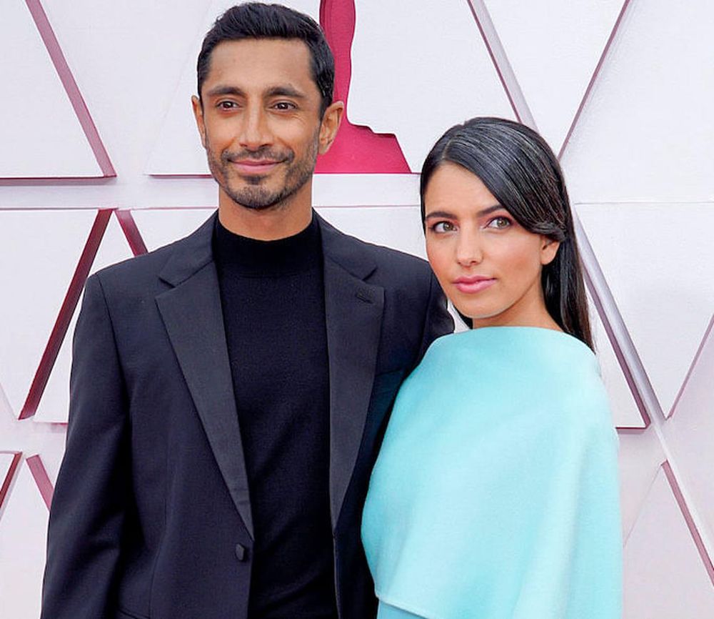 Riz Ahmed and his wife, and Fatima Farheen Mirza arrive at the Oscars on Sunday, April 25, 2021. (Photo: Chris Pizzello/Getty Images)